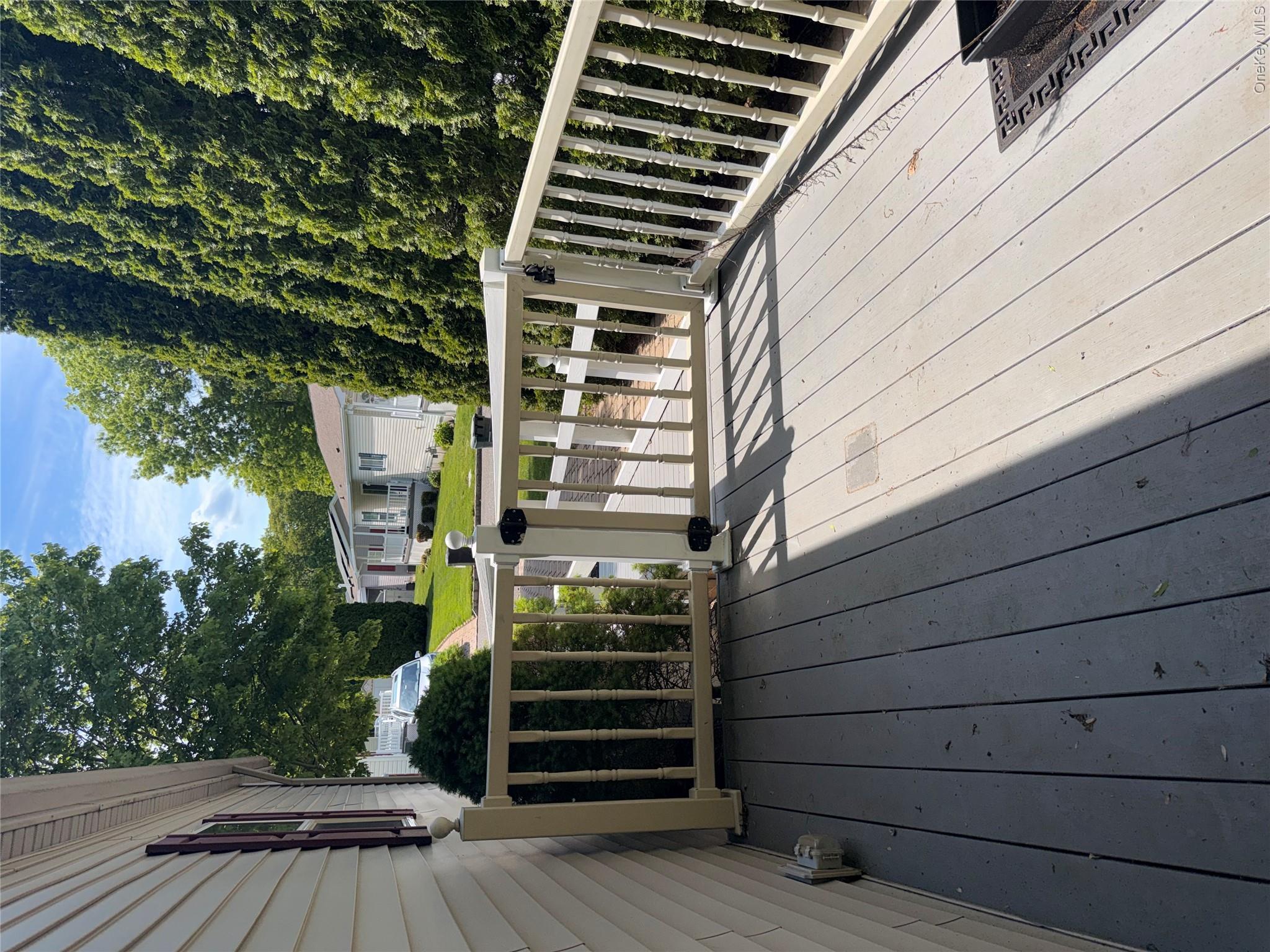 1661 Old Country Road, Unit 516 Riverhead, NY 11901 - Photo 24 of 50 a view of a wooden deck