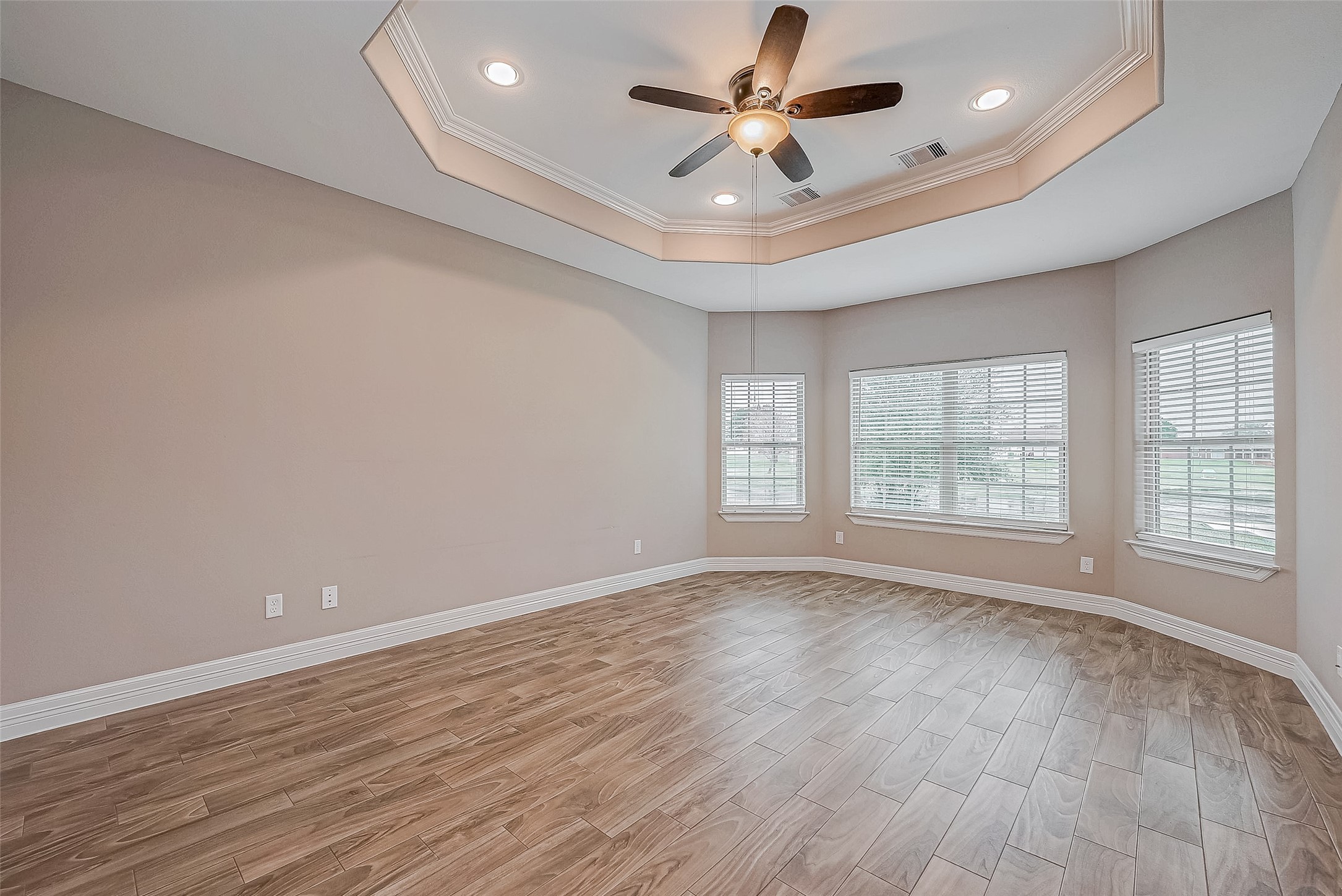 11 Bluebonnet Trinity, TX 75862 - Photo 18 of 46 an empty room with wooden floor and windows