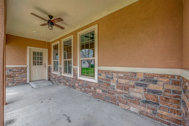 a backyard of a house with outdoor seating