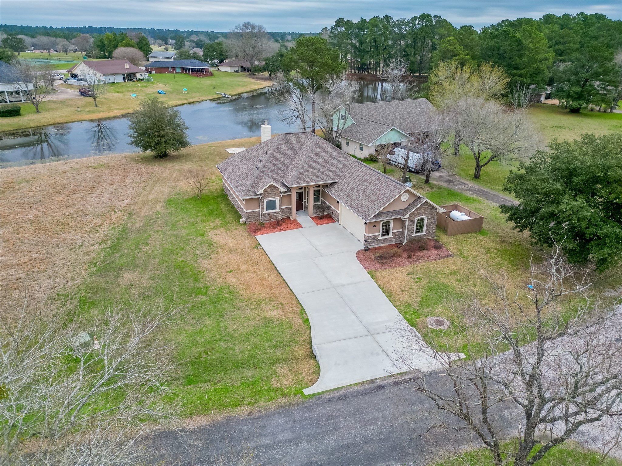 11 Bluebonnet Trinity, TX 75862 - Photo 42 of 46 an aerial view of a house with outdoor space and a lake view