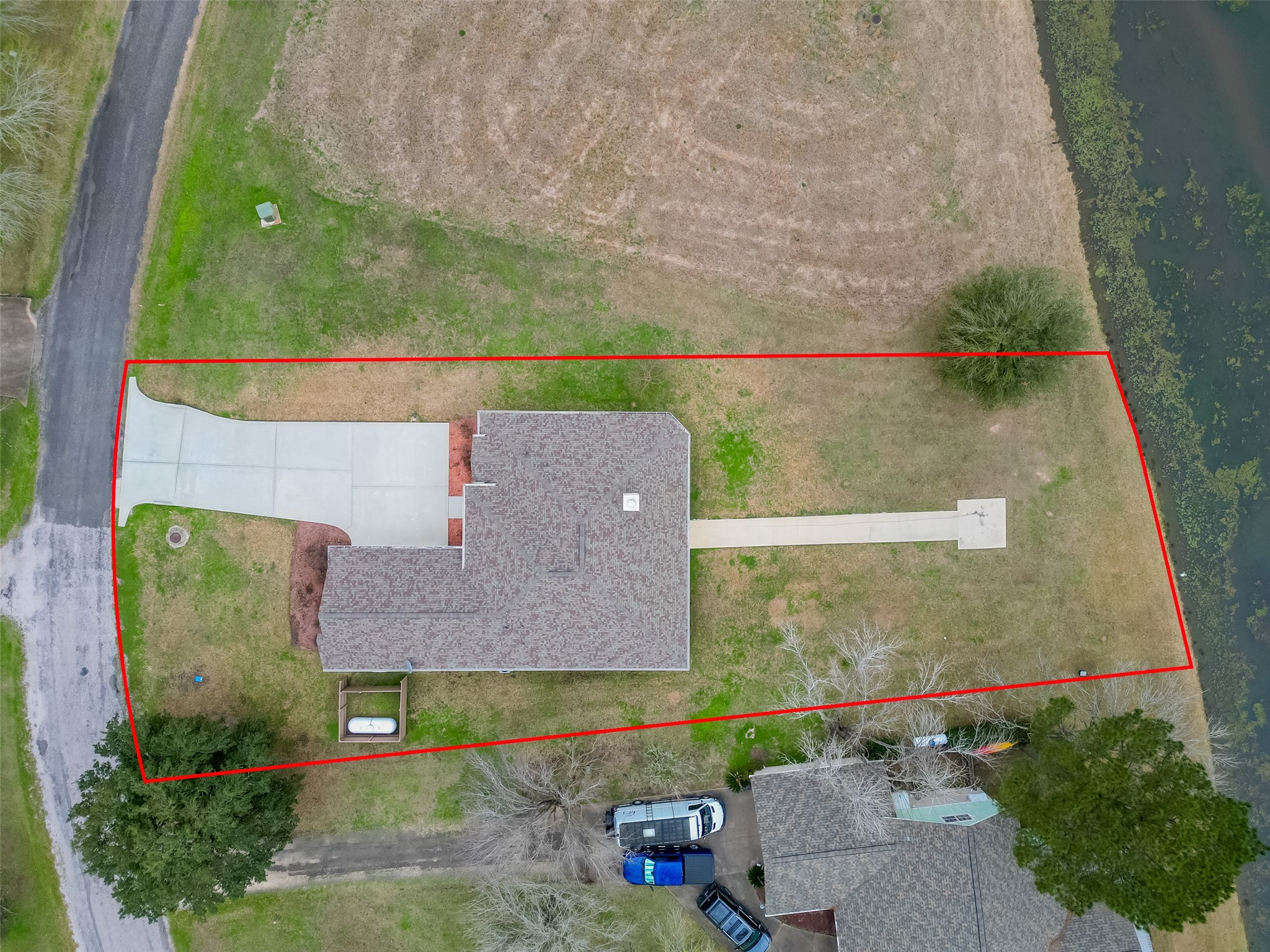 11 Bluebonnet Trinity, TX 75862 - Photo 43 of 46 an aerial view of a house with a yard and a large tree