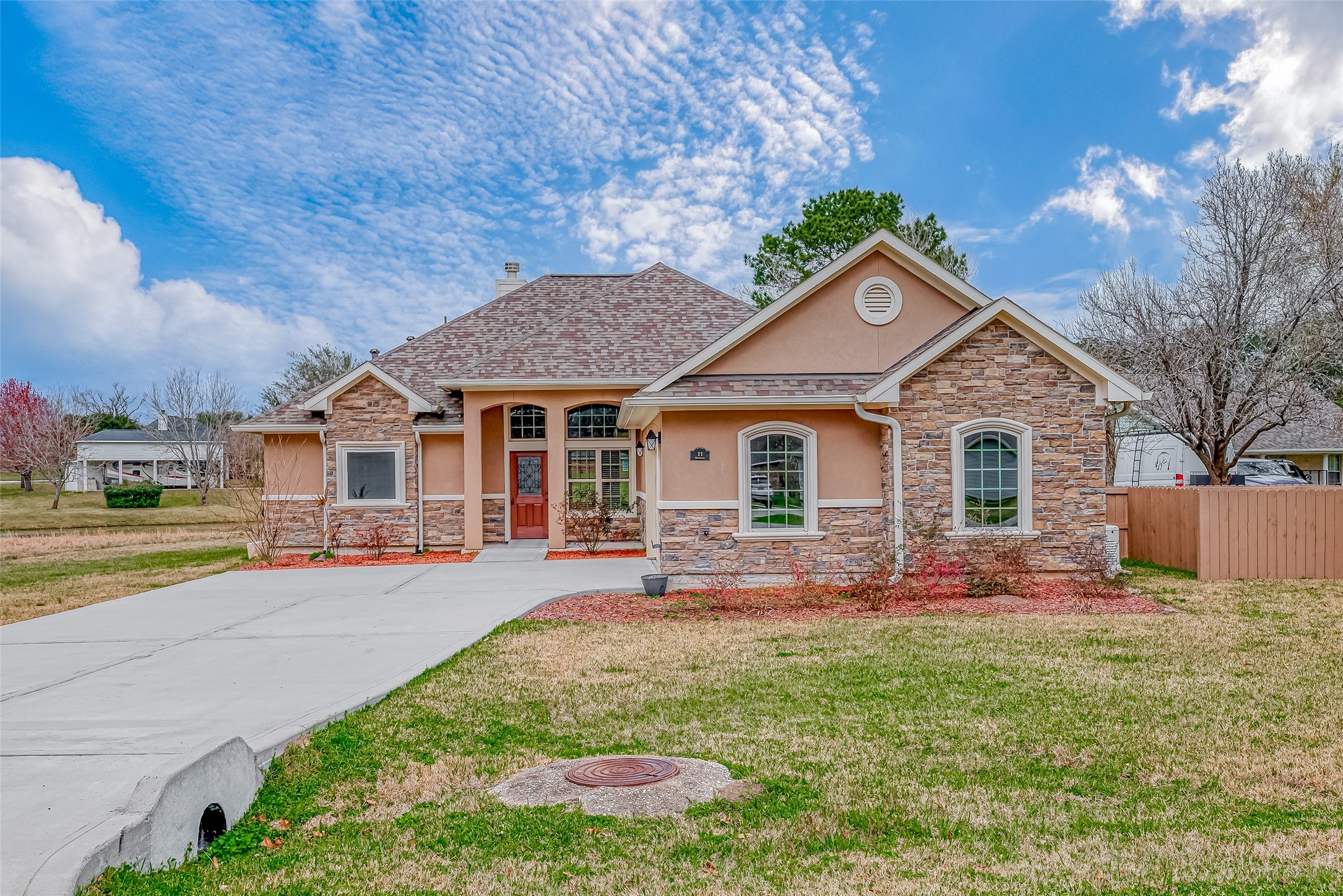 11 Bluebonnet Trinity, TX 75862 - Photo 46 of 46 a front view of a house with a yard and potted plants