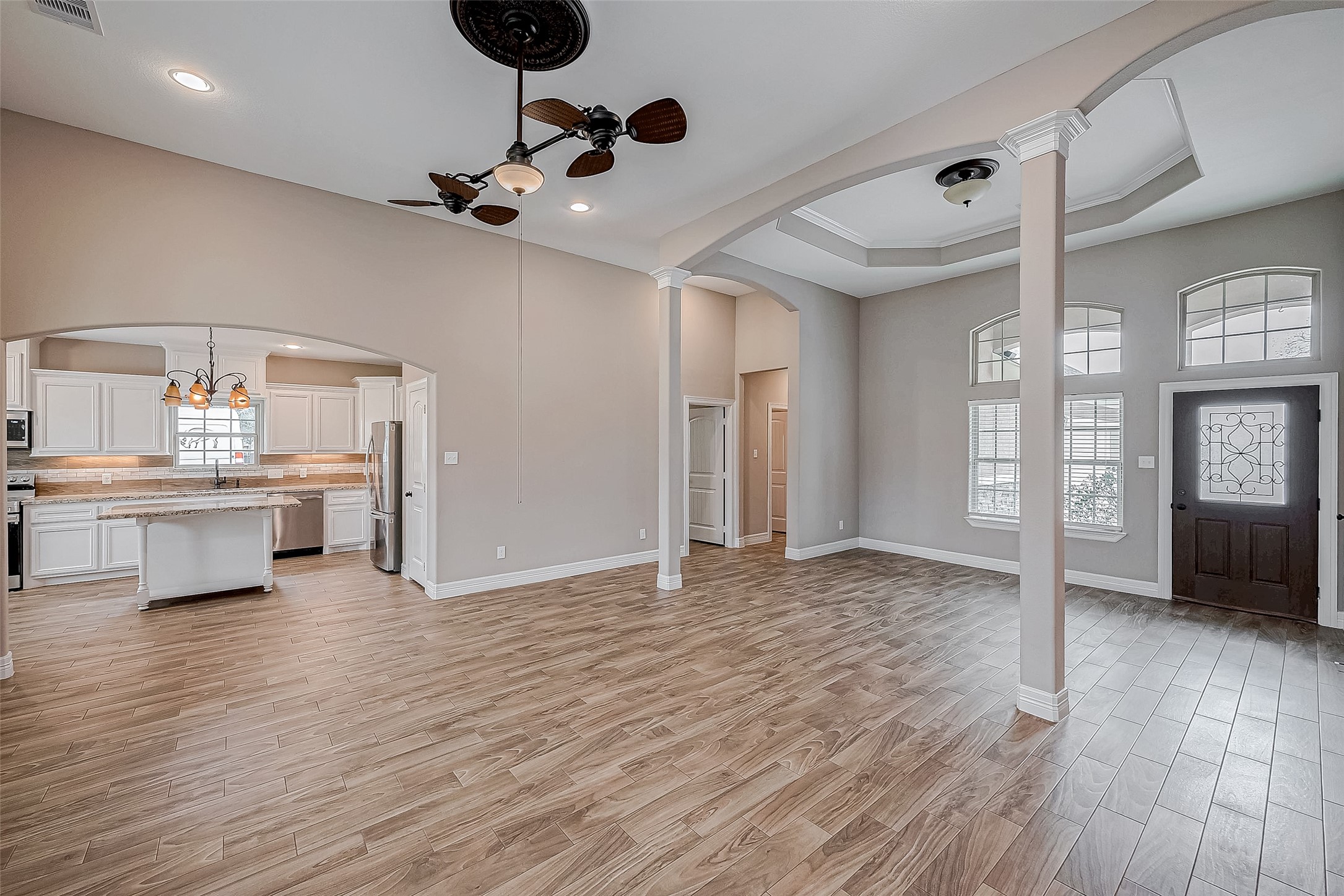 11 Bluebonnet Trinity, TX 75862 - Photo 5 of 46 a view of an empty room and kitchen with wooden floor