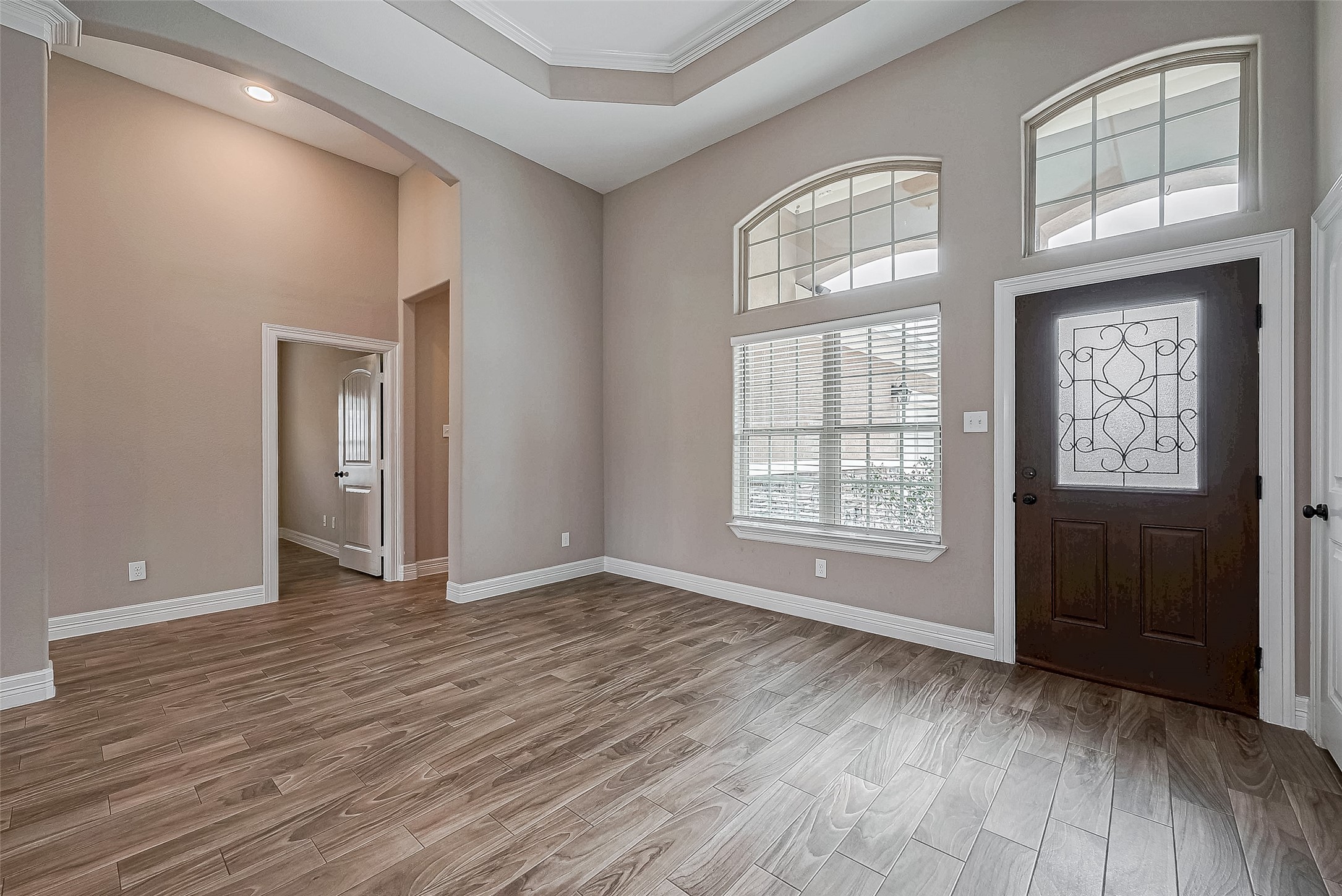 11 Bluebonnet Trinity, TX 75862 - Photo 6 of 46 a view of an empty room with wooden floor and a window
