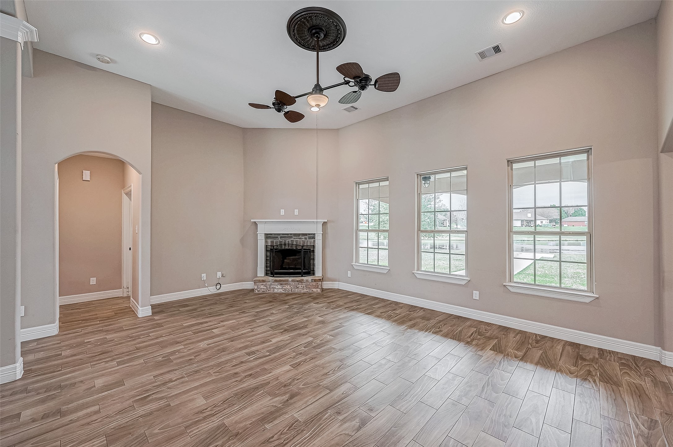 11 Bluebonnet Trinity, TX 75862 - Photo 7 of 46 a view of an empty room with a window and wooden floor
