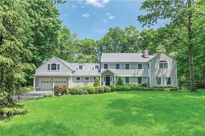 139 Peaceable Ridge Road Ridgefield, CT 06877 - Photo 1 of 1 a front view of a house with a yard