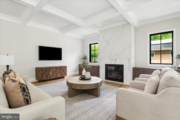 a large kitchen with kitchen island a island a sink a stove and a center island