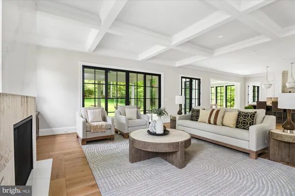 a kitchen with stainless steel appliances a stove a sink a counter space and wooden floor