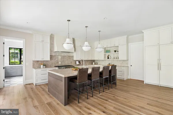 a kitchen with a cabinets and window