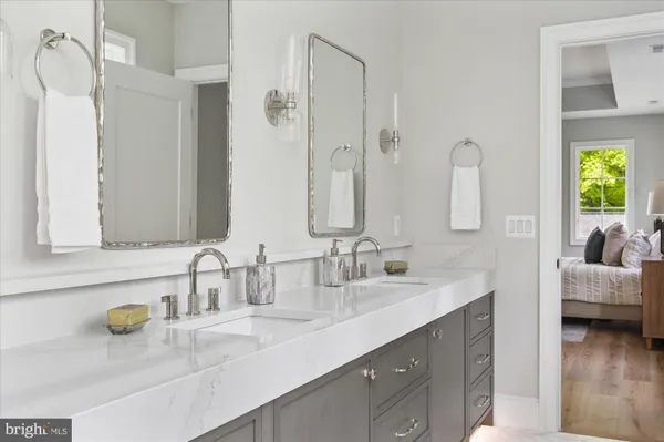 a bathroom with a toilet sink shower and mirror