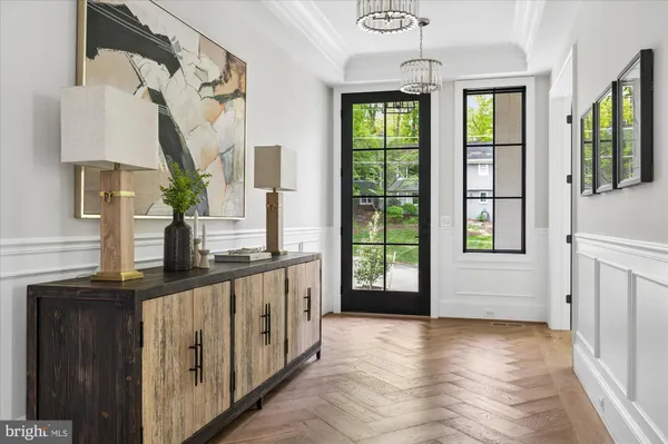 a view of a livingroom with furniture window and wooden floor