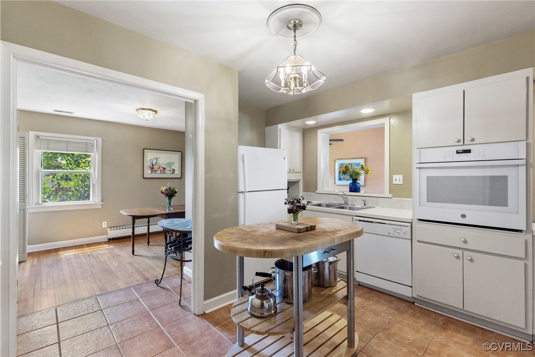 126 Beverly Road Ashland, VA 23005 - Photo 13 of 30 a view of a dining room with furniture and chandelier