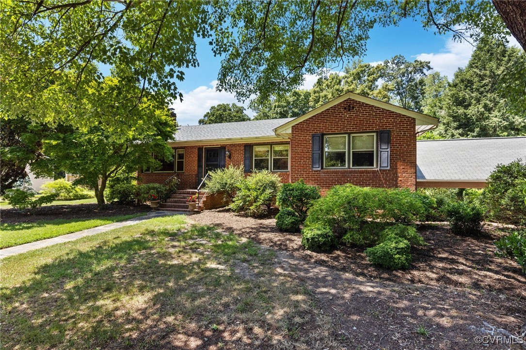 126 Beverly Road Ashland, VA 23005 - Photo 3 of 30 a front view of a house with a yard and trees