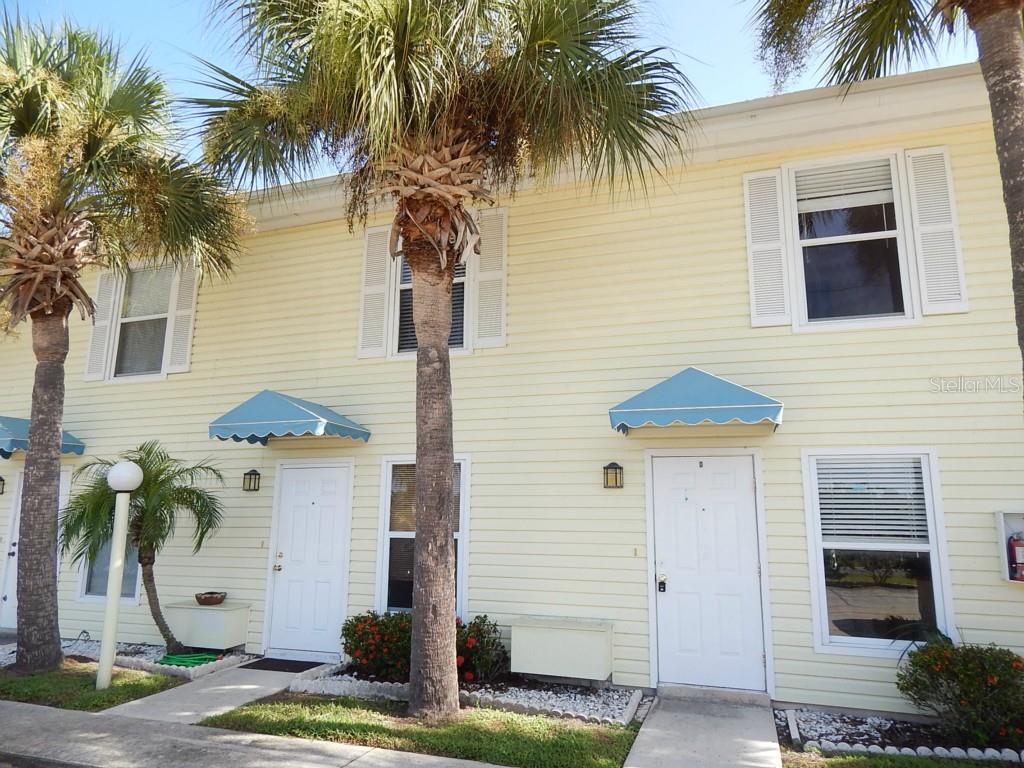 26320 Rampart Boulevard, Unit C Punta Gorda, FL 33983 - Photo 1 of 1 a front view of a house with a yard