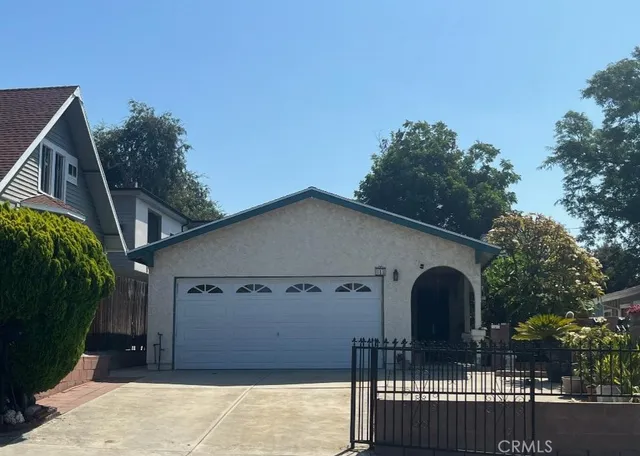 a front view of a house with parking space