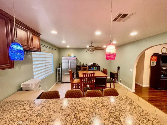 a bedroom with furniture and a wooden floor