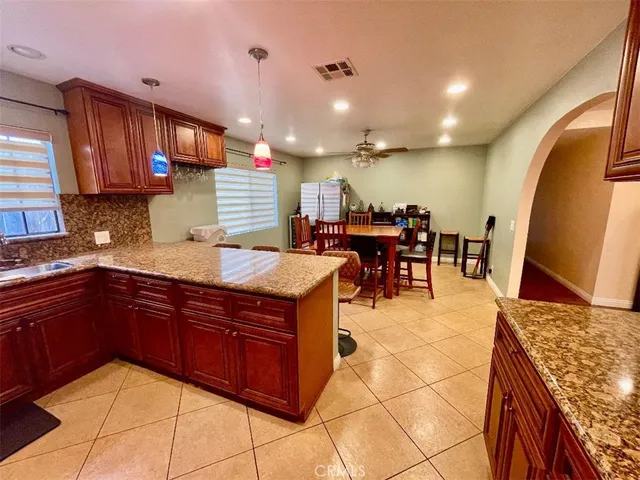 a kitchen with lots of counter top space and appliances