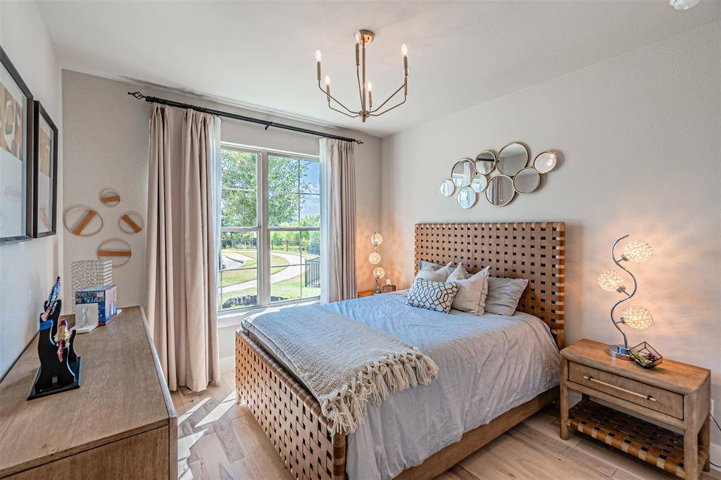 1070 Adair Road Prosper, TX 75078 - Photo 20 of 40 Bright room featuring a large double-hung window with a verdant outdoor landscape