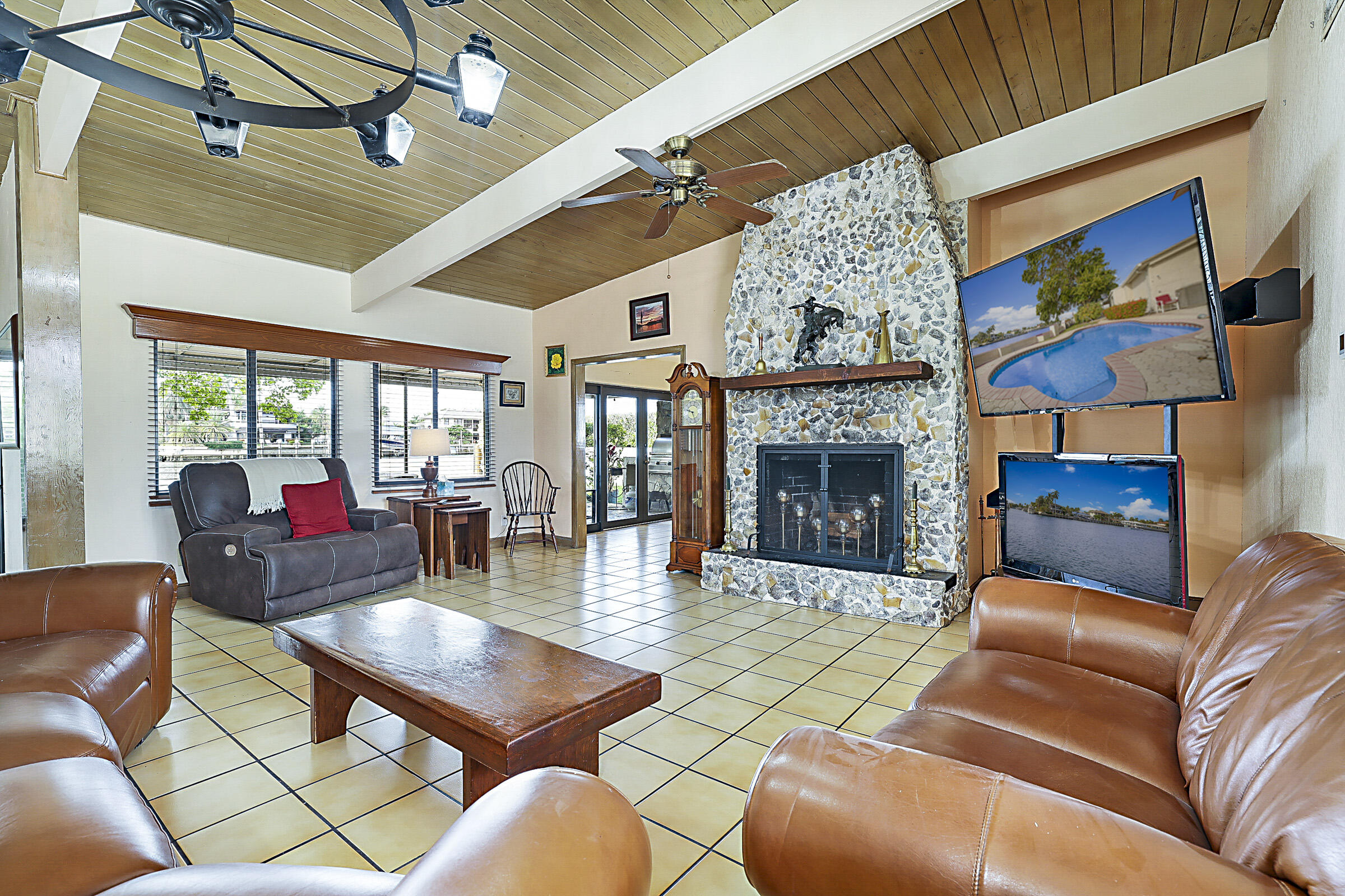 1901 North Riverside Drive Pompano Beach, FL 33062 - Photo 12 of 45 a living room with furniture fireplace and a table