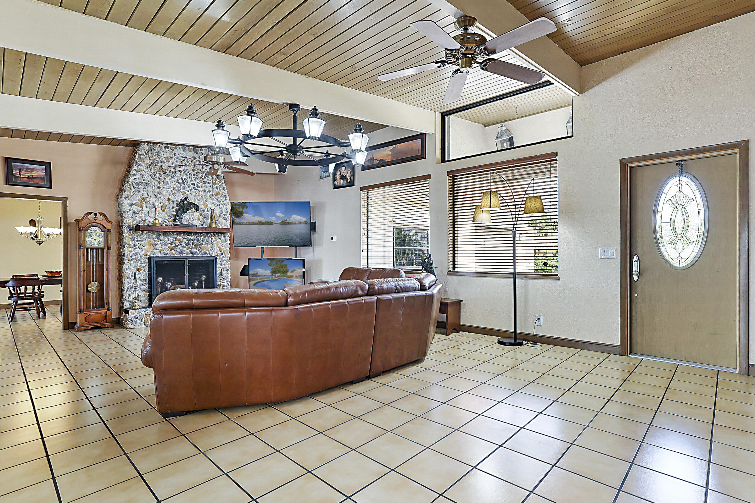 1901 North Riverside Drive Pompano Beach, FL 33062 - Photo 14 of 45 a living room with furniture and a chandelier