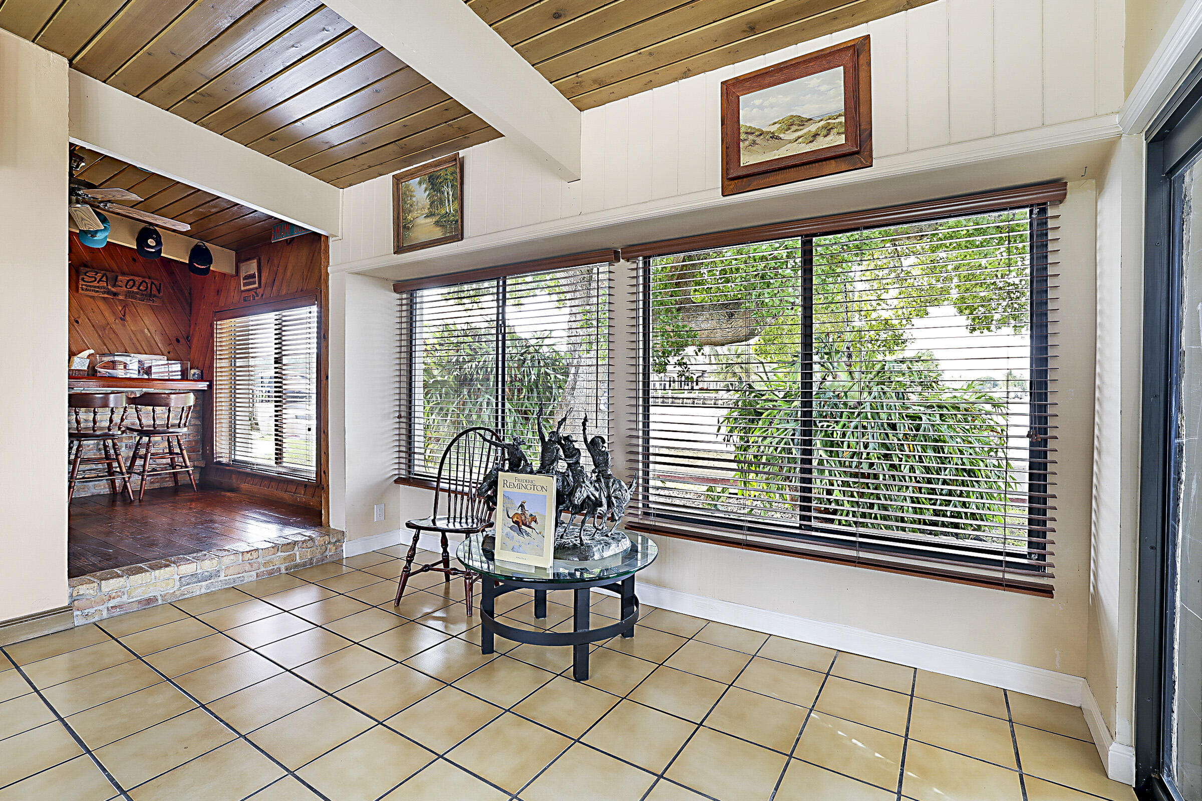 1901 North Riverside Drive Pompano Beach, FL 33062 - Photo 17 of 45 a dining room with furniture and large windows
