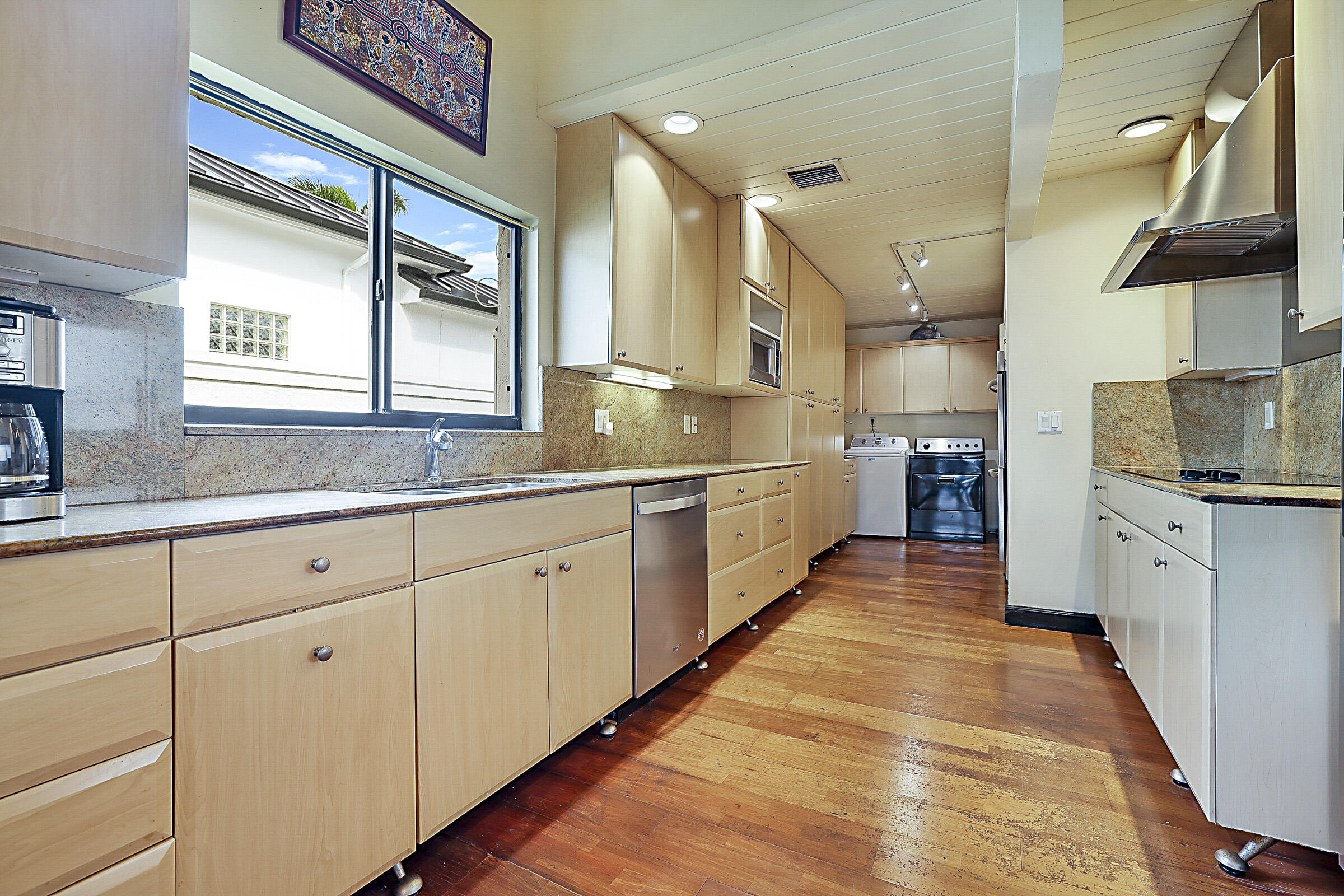 1901 North Riverside Drive Pompano Beach, FL 33062 - Photo 23 of 45 a large kitchen with cabinets