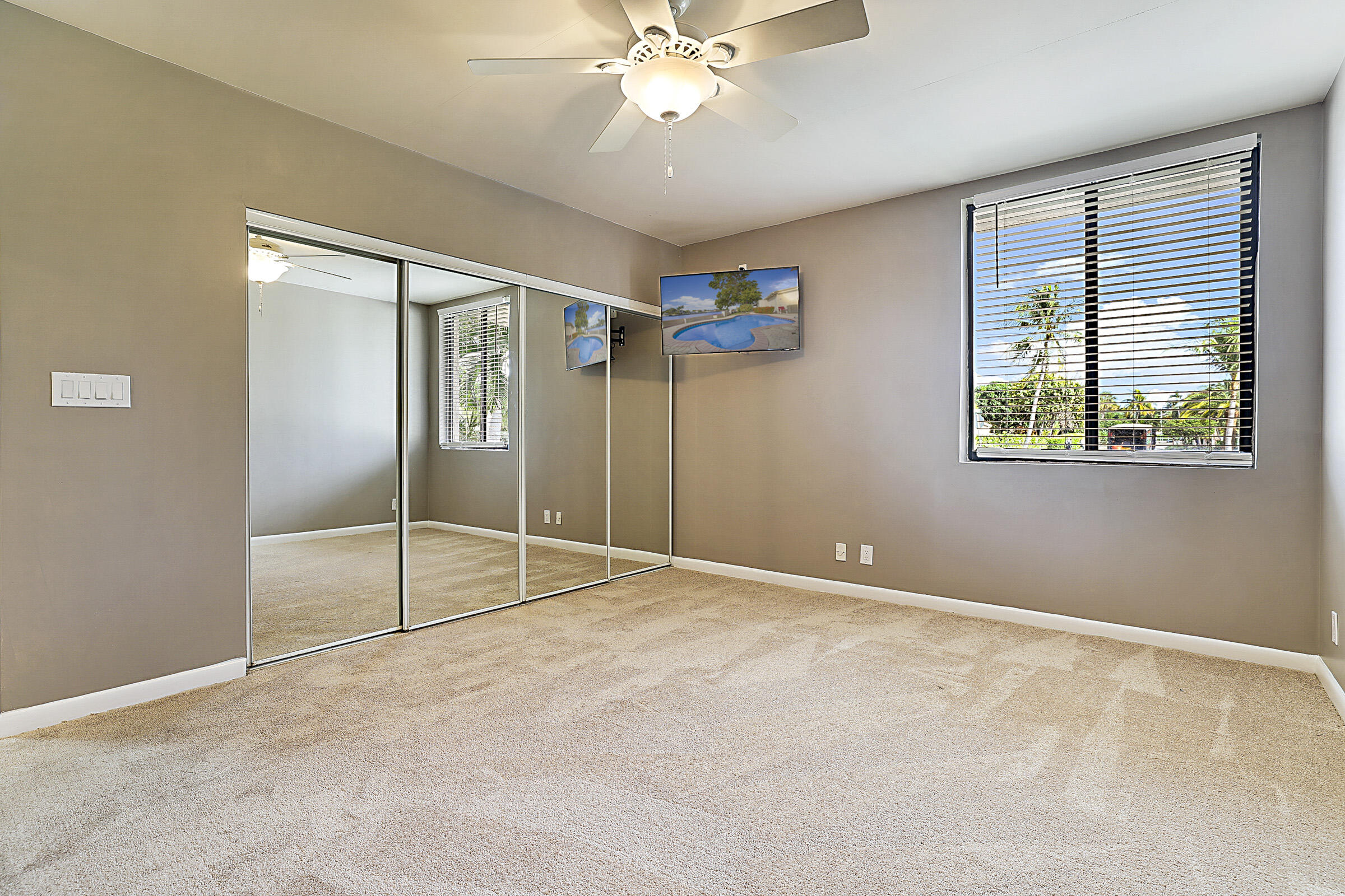 1901 North Riverside Drive Pompano Beach, FL 33062 - Photo 27 of 45 an empty room with fan and windows