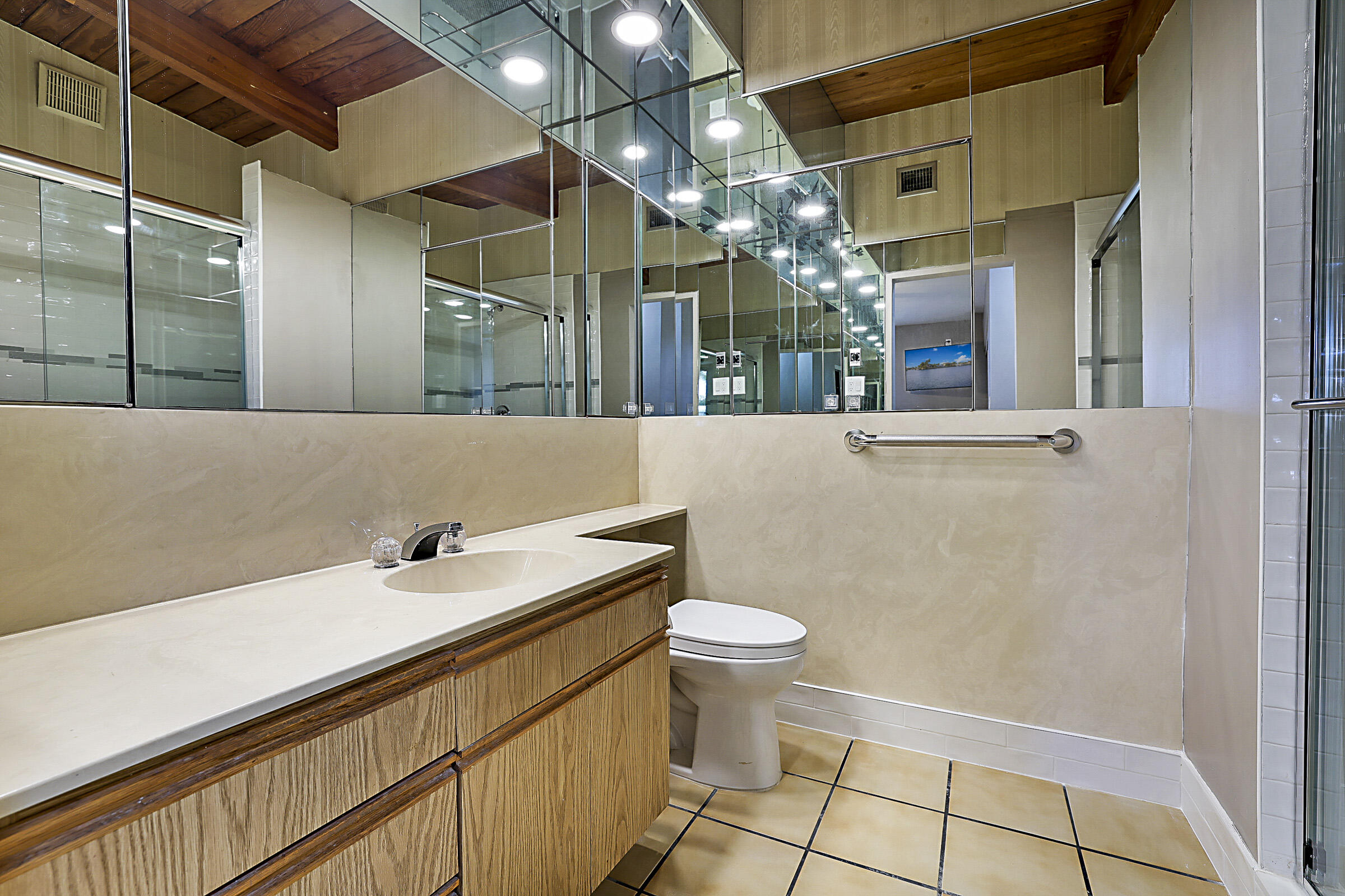 1901 North Riverside Drive Pompano Beach, FL 33062 - Photo 29 of 45 a bathroom with a sink and a mirror