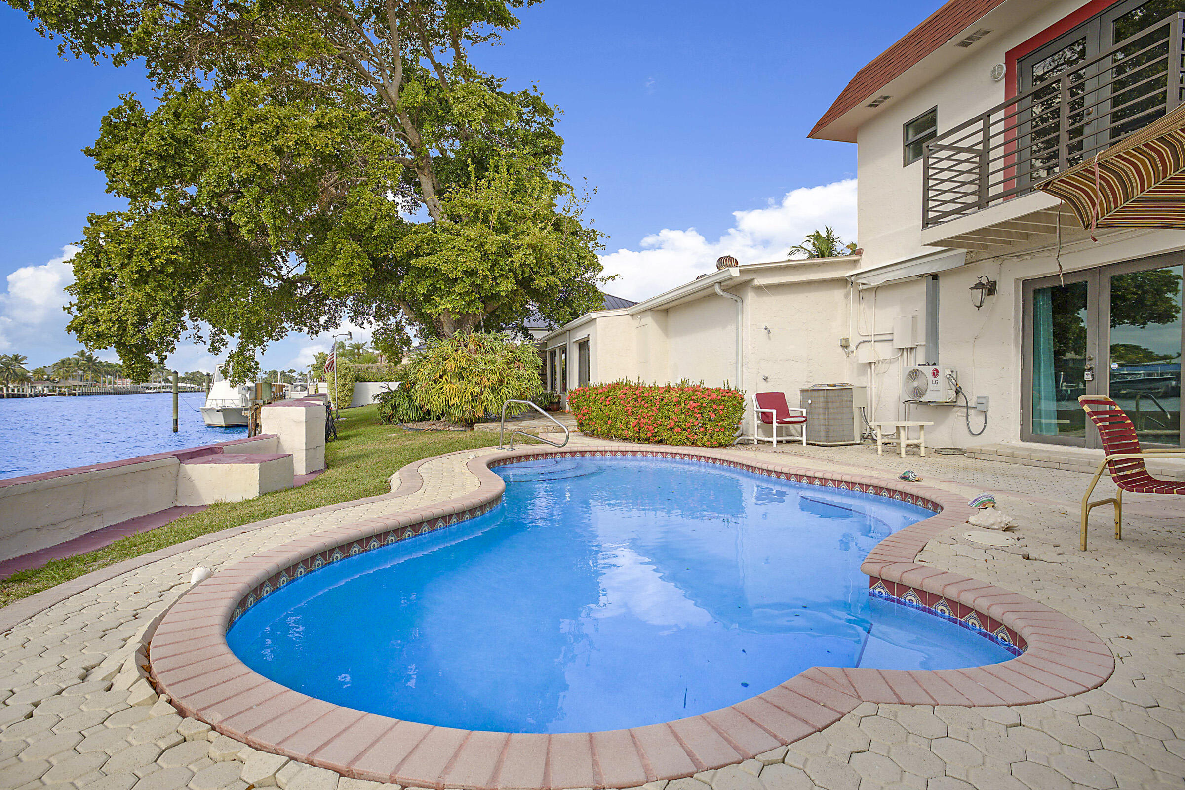 1901 North Riverside Drive Pompano Beach, FL 33062 - Photo 3 of 45 a view of a swimming pool with a patio