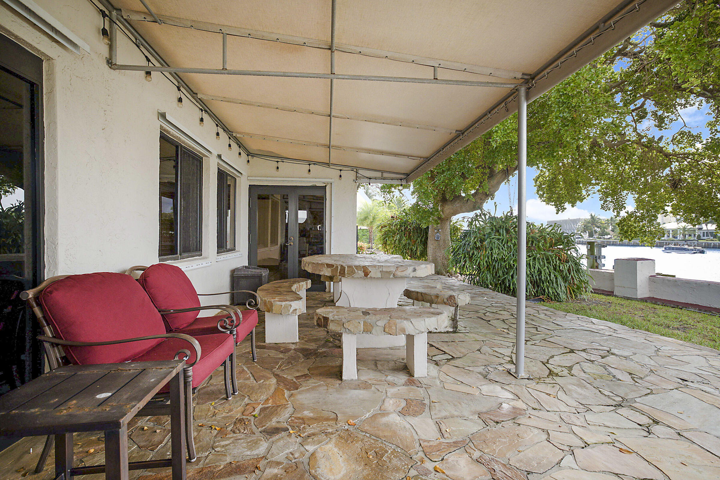 1901 North Riverside Drive Pompano Beach, FL 33062 - Photo 35 of 45 a view of a chairs with a table in the patio