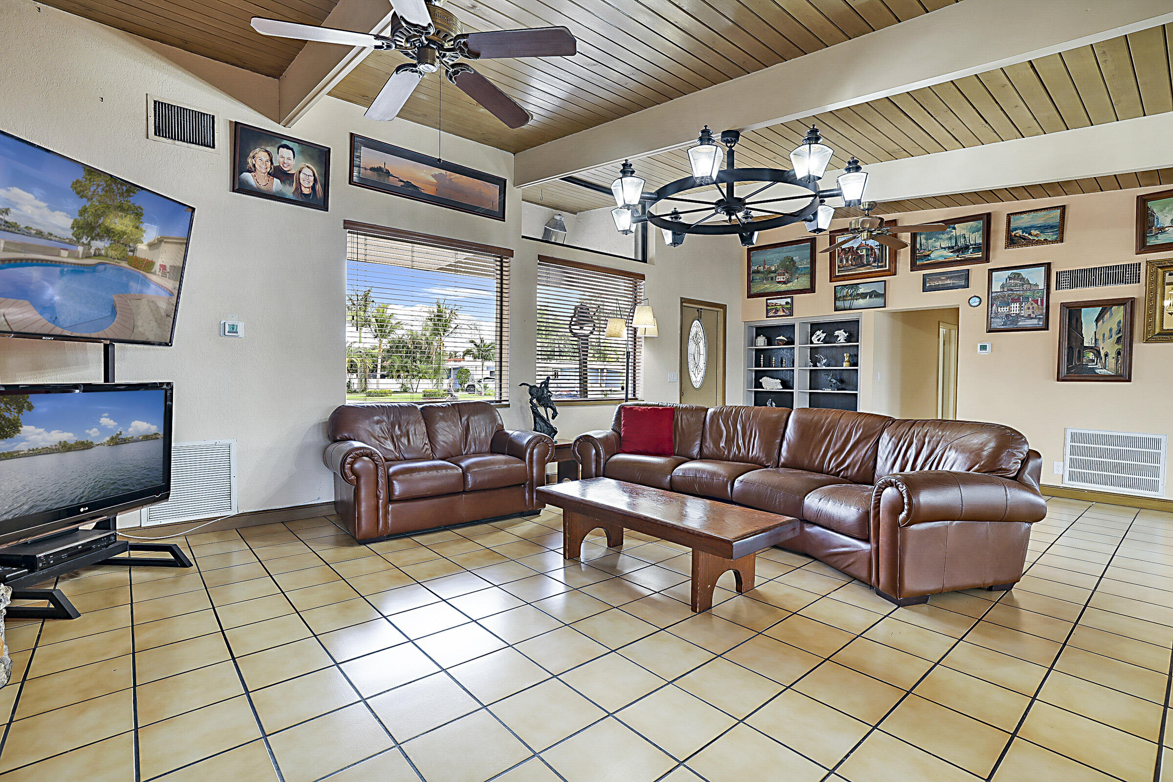 1901 North Riverside Drive Pompano Beach, FL 33062 - Photo 10 of 45 a living room with furniture and a flat screen tv