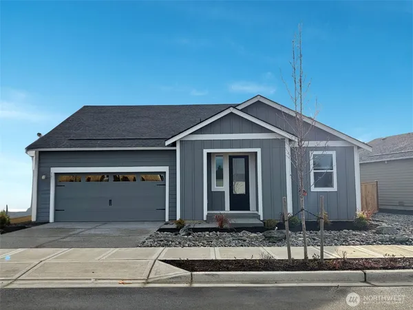 a front view of a house with garage