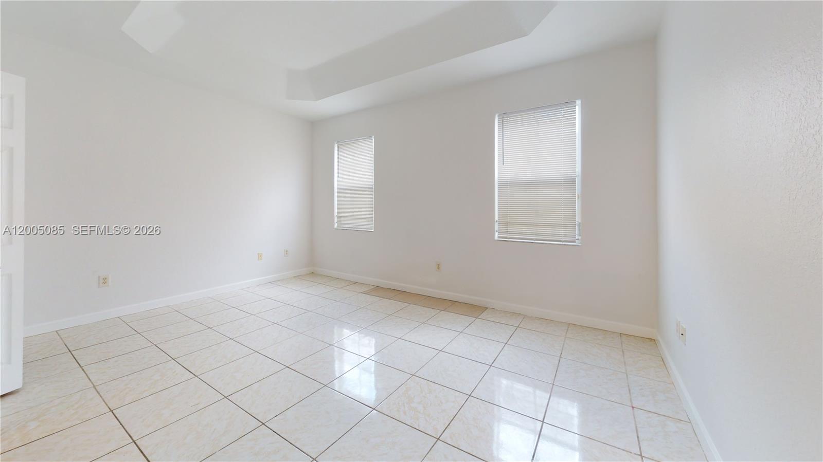 2929 Southeast 2nd Street, Unit 7 Homestead, FL 33033 - Photo 14 of 24 an empty room with windows