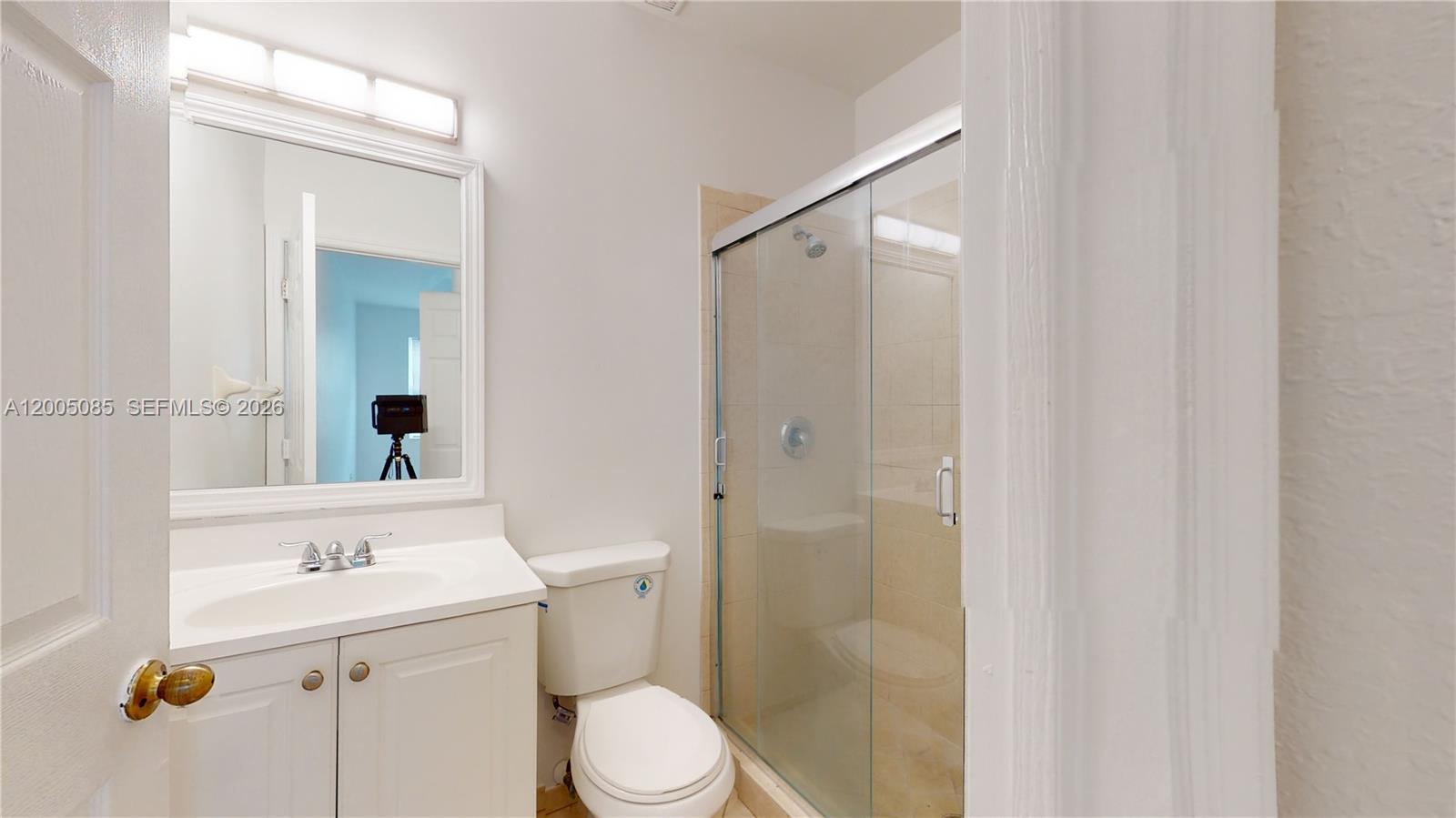 2929 Southeast 2nd Street, Unit 7 Homestead, FL 33033 - Photo 18 of 24 a bathroom with a sink a toilet and shower