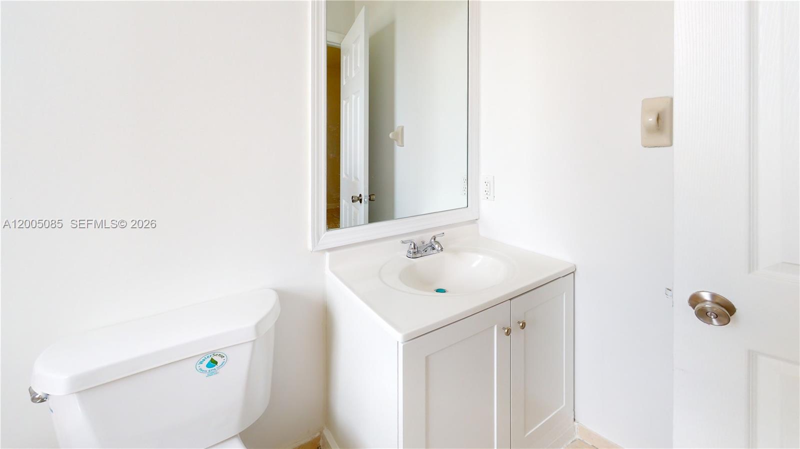 2929 Southeast 2nd Street, Unit 7 Homestead, FL 33033 - Photo 22 of 24 a bathroom with a sink and a mirror