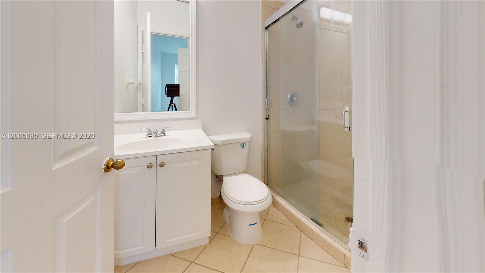 2929 Southeast 2nd Street, Unit 7 Homestead, FL 33033 - Photo 23 of 24 a bathroom with a sink a toilet and shower