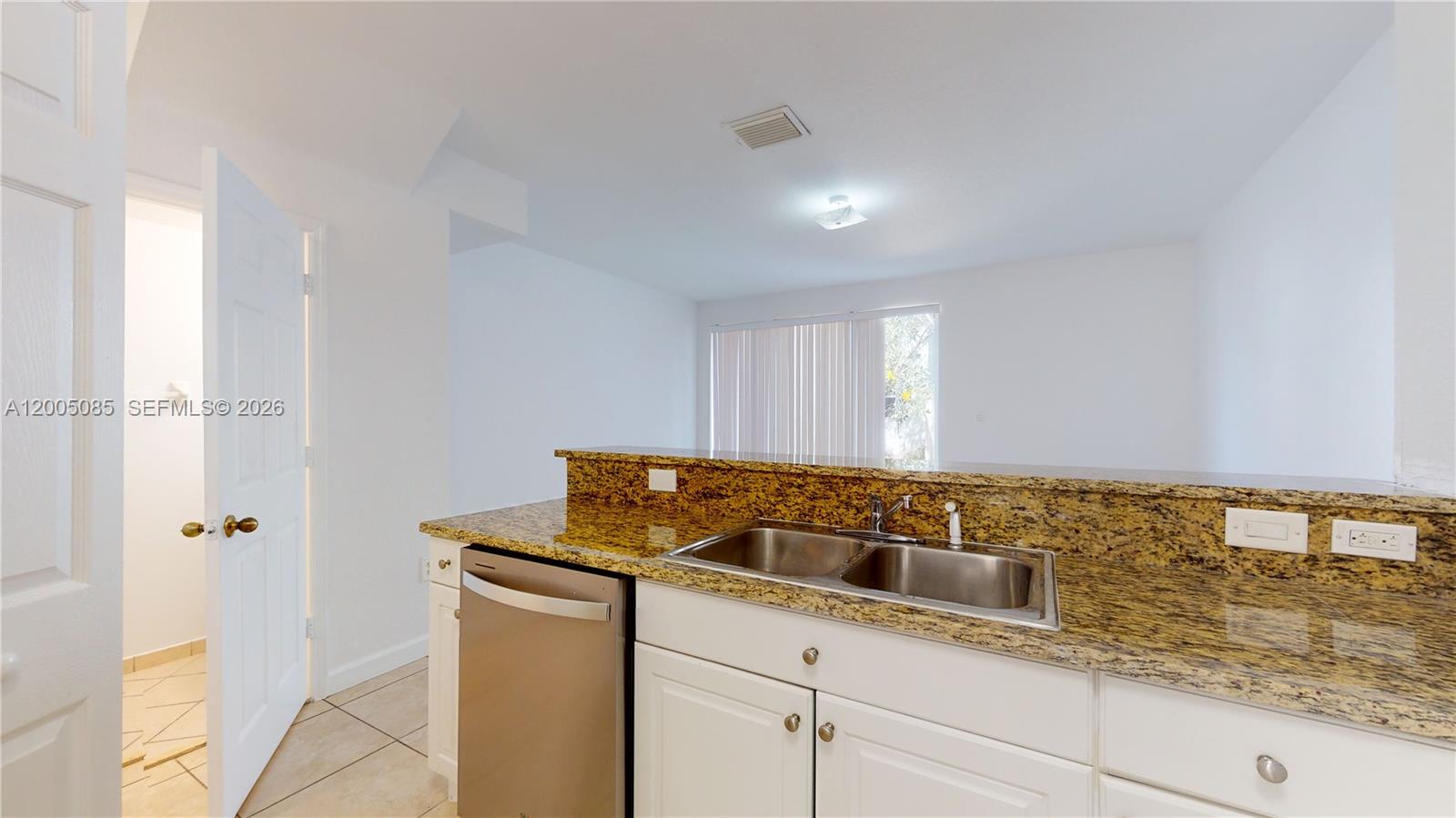 2929 Southeast 2nd Street, Unit 7 Homestead, FL 33033 - Photo 6 of 24 a kitchen with a sink and cabinets