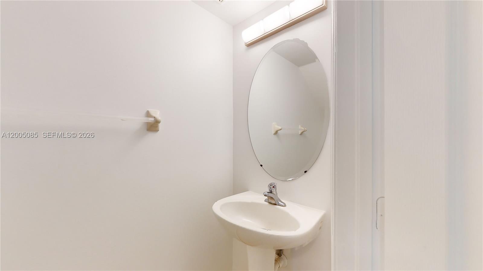 2929 Southeast 2nd Street, Unit 7 Homestead, FL 33033 - Photo 7 of 24 a bathroom with a sink and mirror