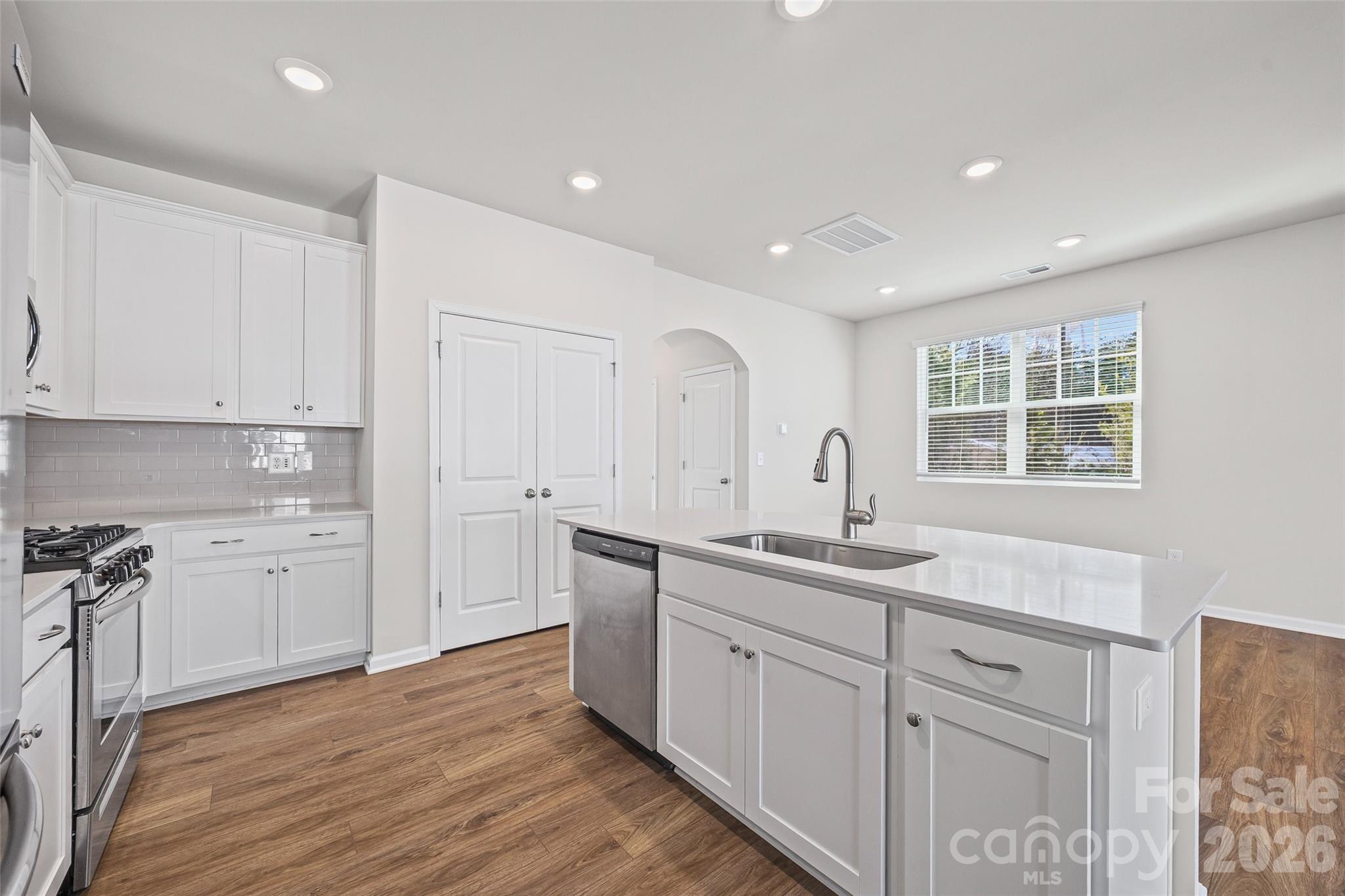612 Rustic Path Lane Fort Mill, SC 29708 - Photo 12 of 38 a kitchen with sink stove and cabinets