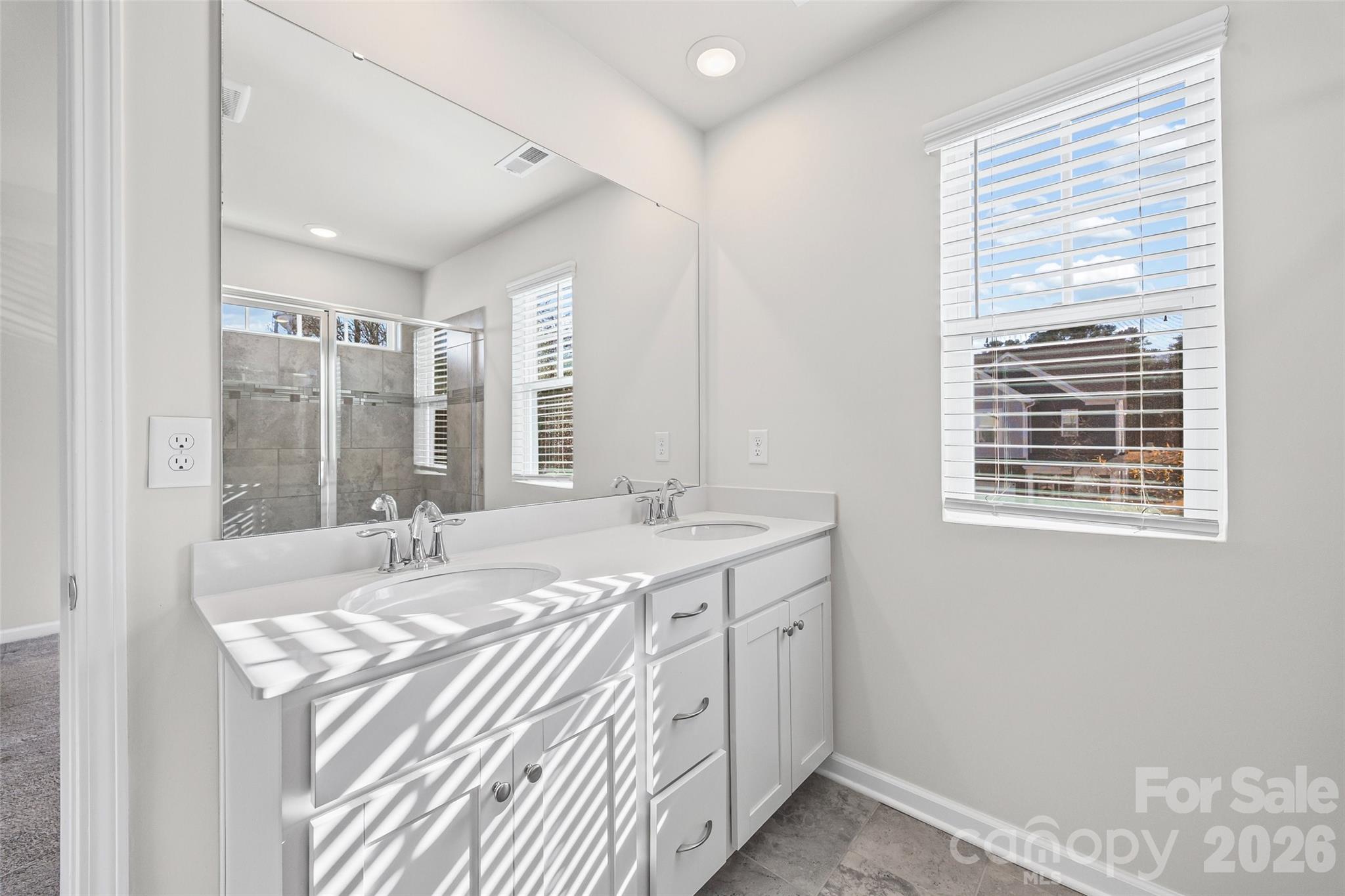 612 Rustic Path Lane Fort Mill, SC 29708 - Photo 17 of 38 a bathroom with a sink double vanity and a shower