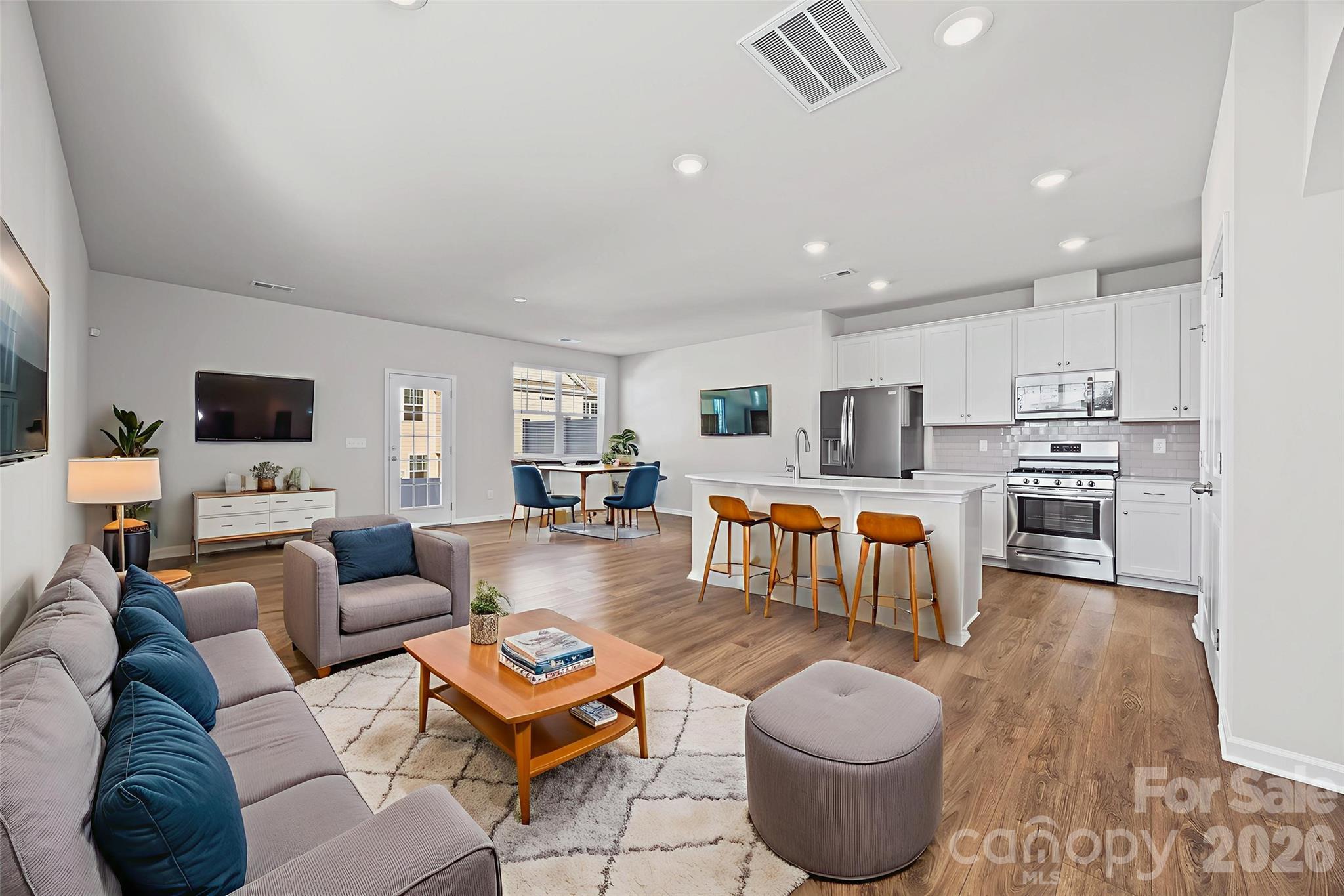 612 Rustic Path Lane Fort Mill, SC 29708 - Photo 2 of 38 a living room with furniture and a flat screen tv