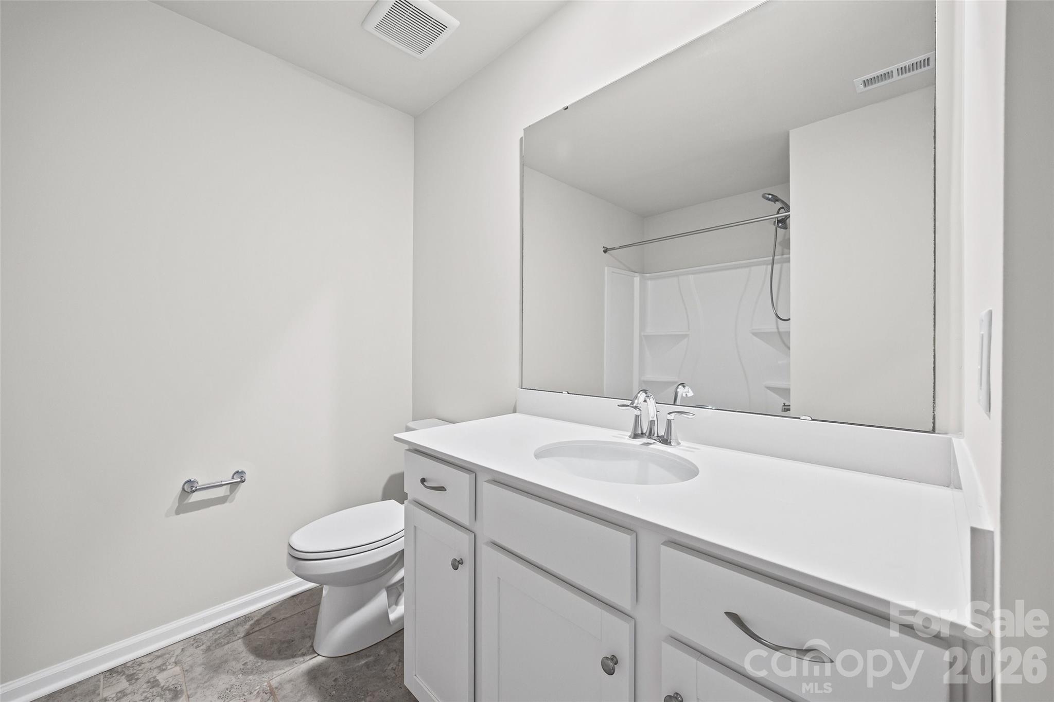 612 Rustic Path Lane Fort Mill, SC 29708 - Photo 21 of 38 a bathroom with a sink toilet and vanity