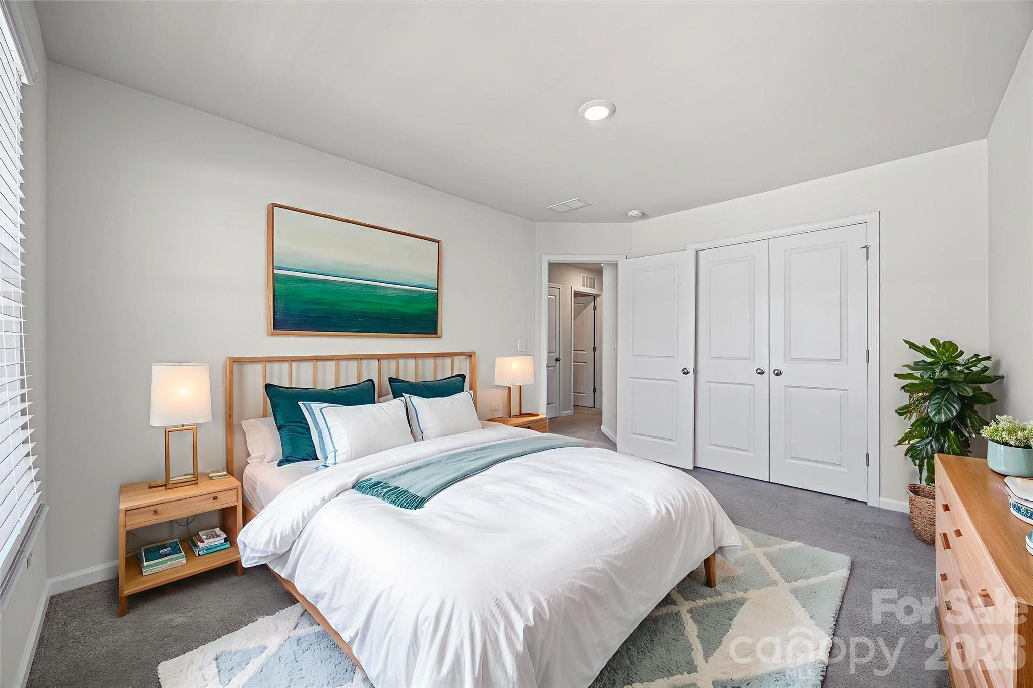 612 Rustic Path Lane Fort Mill, SC 29708 - Photo 4 of 38 a bedroom with a bed and a potted plant