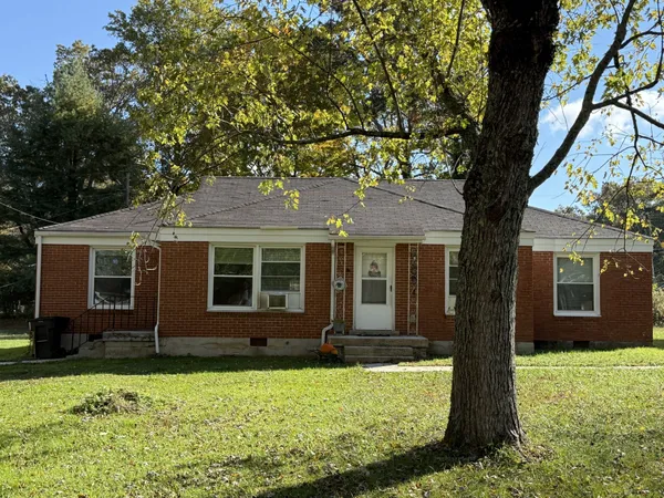 front view of a house with a yard