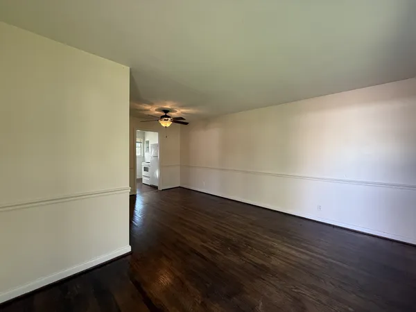 a view of a room with wooden floor