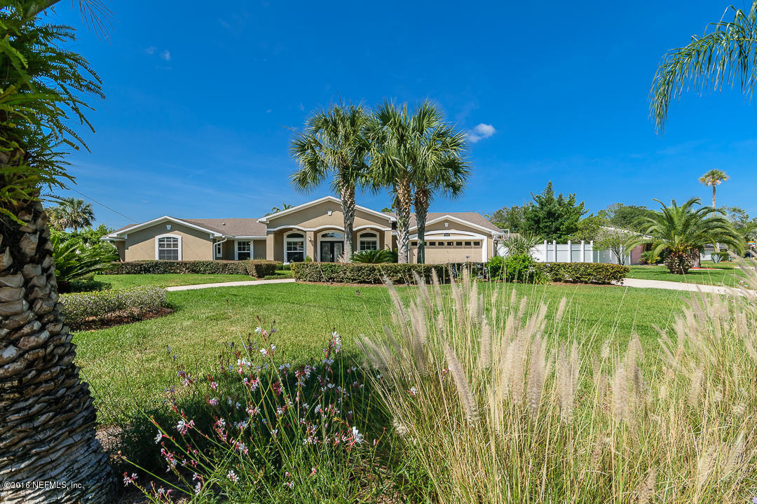 14446 Stacey Road Jacksonville, FL 32250 - Photo 1 of 31 a house view with swimming pool in front of it