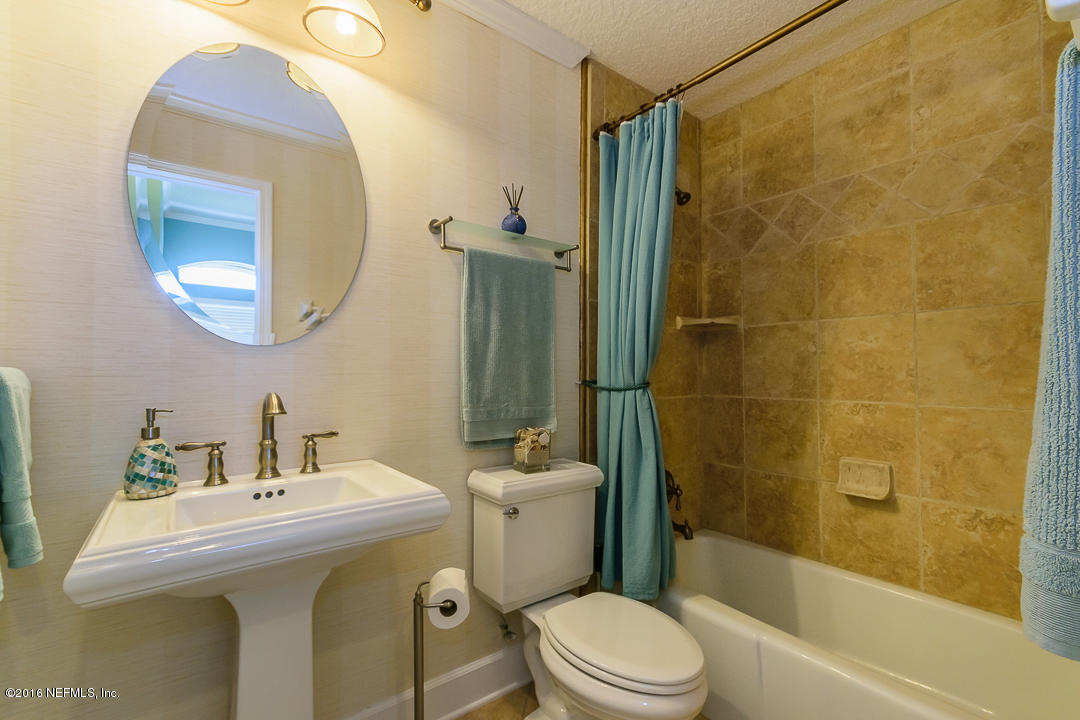 14446 Stacey Road Jacksonville, FL 32250 - Photo 25 of 31 a bathroom with a sink a toilet and shower