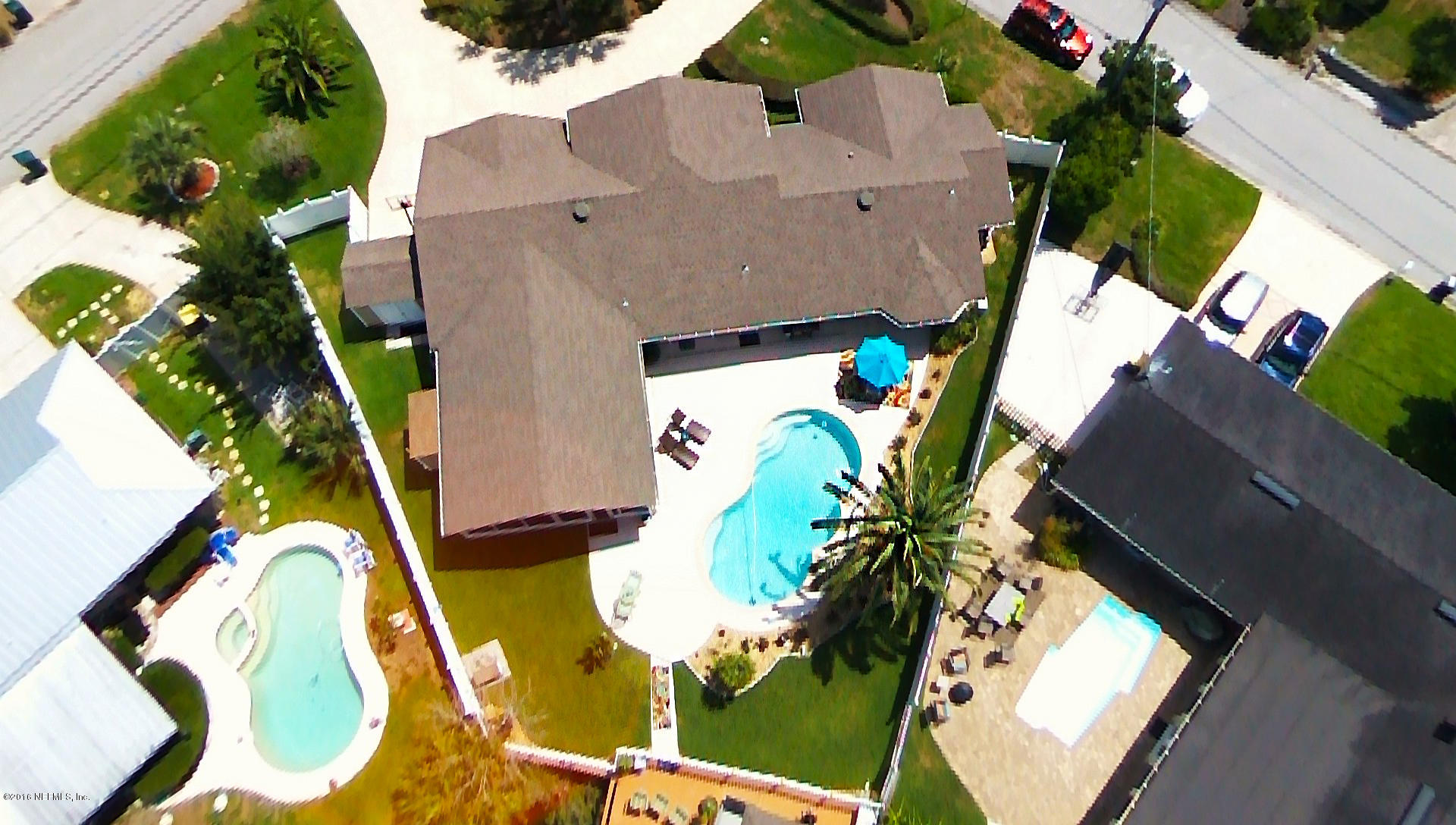 14446 Stacey Road Jacksonville, FL 32250 - Photo 29 of 31 an aerial view of a house with a yard and potted plants