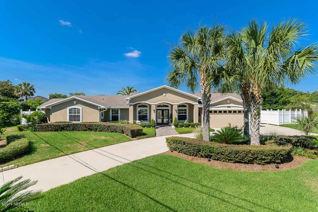14446 Stacey Road Jacksonville, FL 32250 - Photo 3 of 31 a front view of a house with a yard