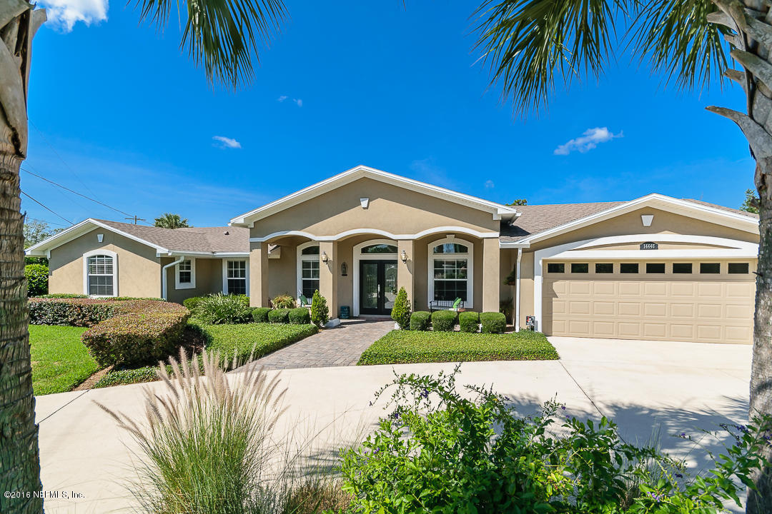 14446 Stacey Road Jacksonville, FL 32250 - Photo 4 of 31 a front view of a house with a garden